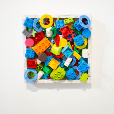 jeff schofield recycled toys in paper frame